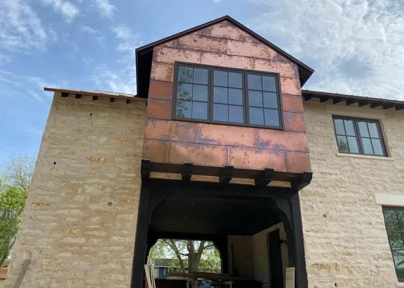 Copper metal panel facade on a stone building for Metal Roof Coating in Dobbs Ferry